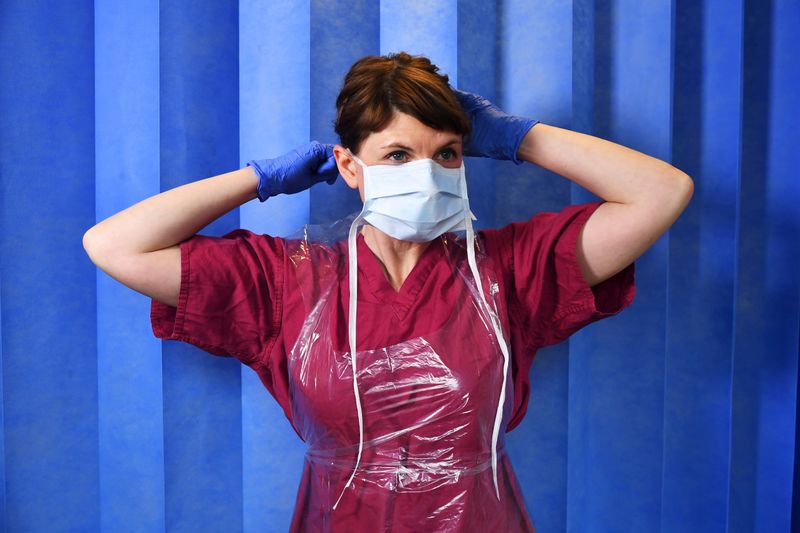 FILE PHOTO: Doctor Nicky Longley puts on her Level 1