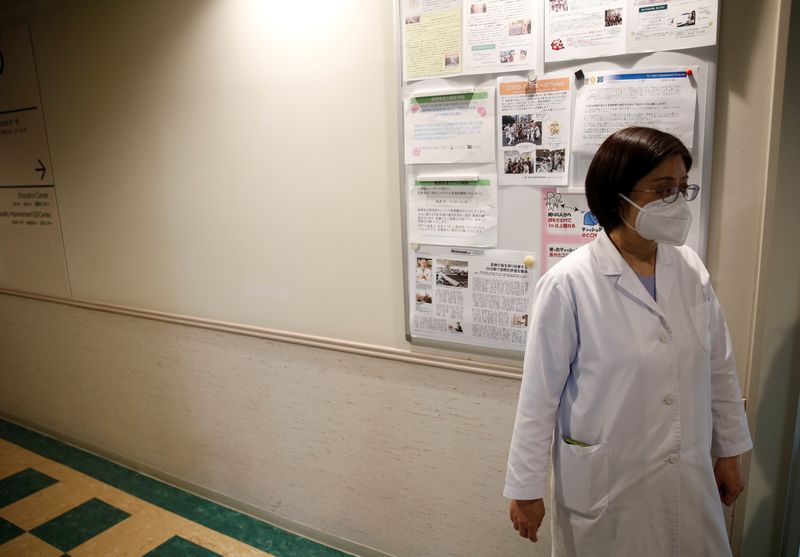 Fumie Sakamoto, a nurse of St. Luke’s International Hospital stands