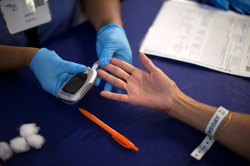 FILE PHOTO: A person receives a test for diabetes during