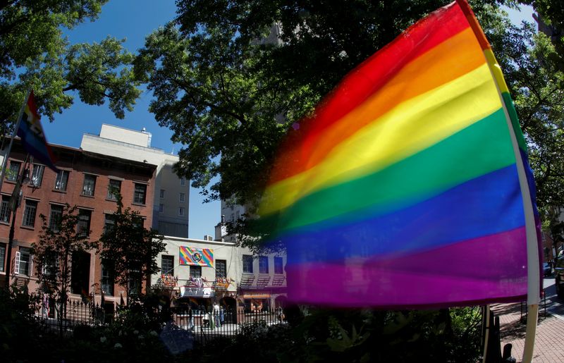 FILE PHOTO: A rainbow flag waves in the wind at