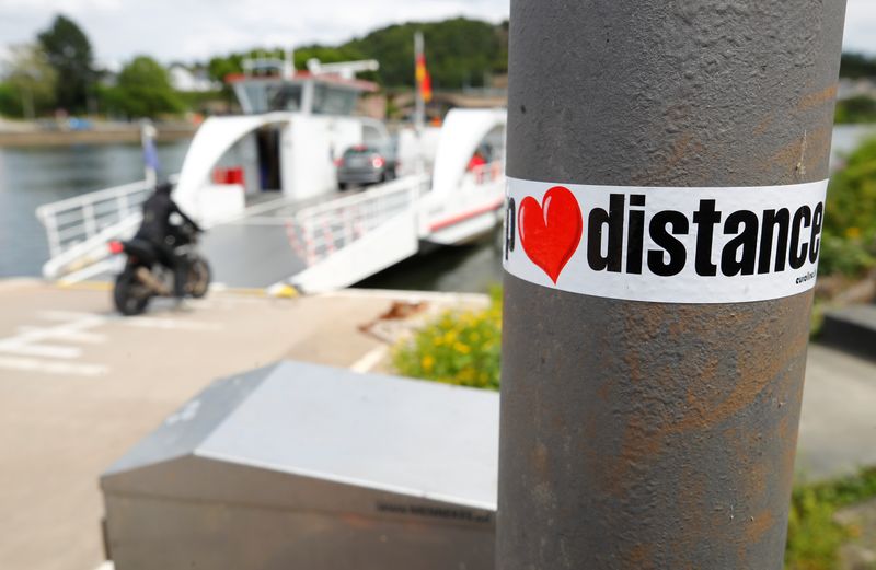FILE PHOTO: A sticker reads “keep distance” as the Moselle