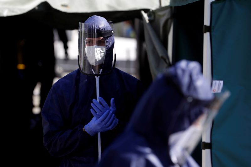 Medical workers get ready to test people for the coronavirus