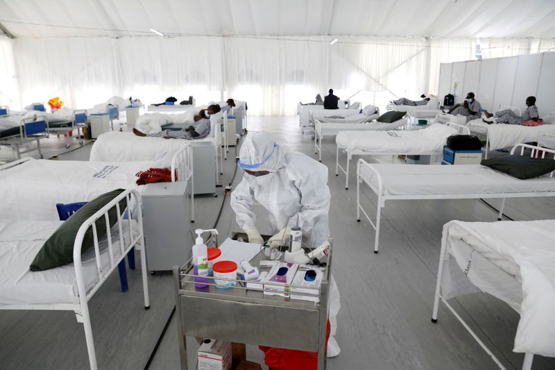 FILE PHOTO: A nurse works inside a field hospital builtÊon