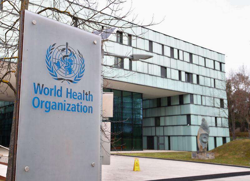 A logo is pictured outside a building of the WHO