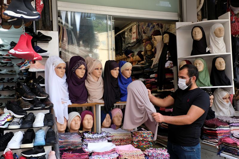 A shopkeeper organizes his stall at Grand Bazaar in Istanbul