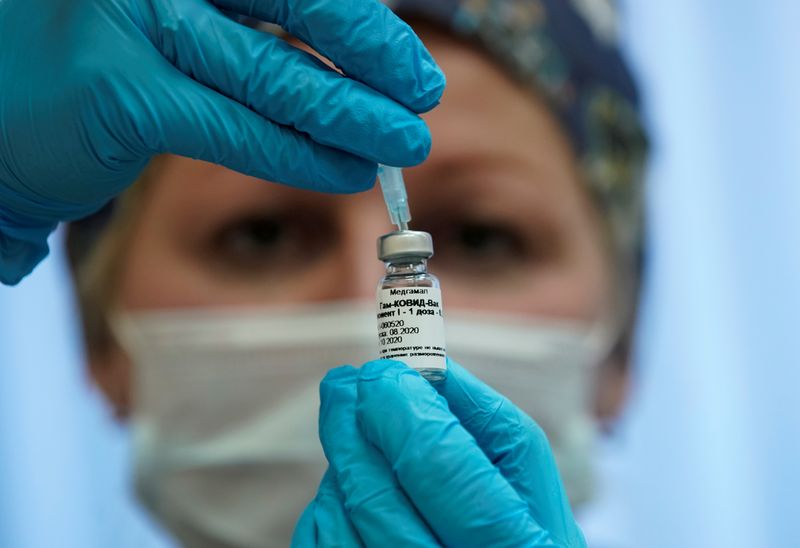 FILE PHOTO: A nurse prepares Russia’s “Sputnik-V” vaccine against the