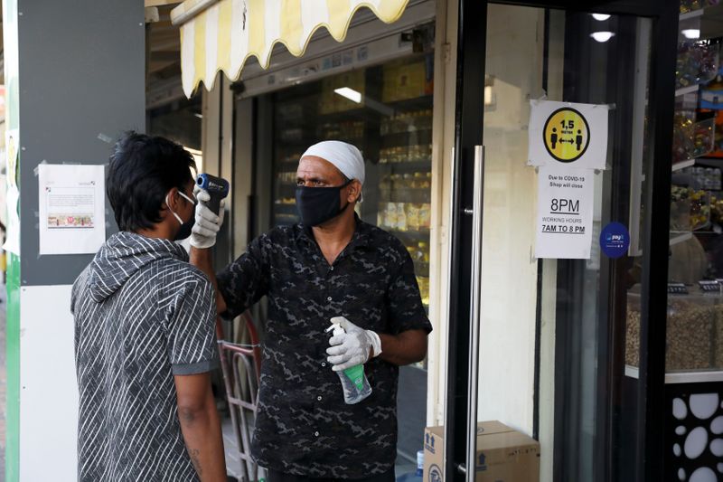 FILE PHOTO: A man wearing a protective face mask has