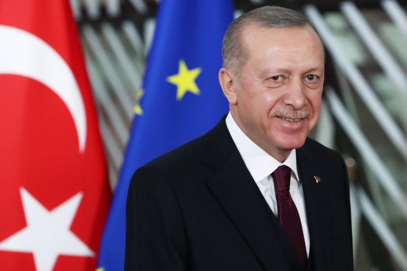 Turkish President Tayyip Erdogan reacts ahead of a meeting with