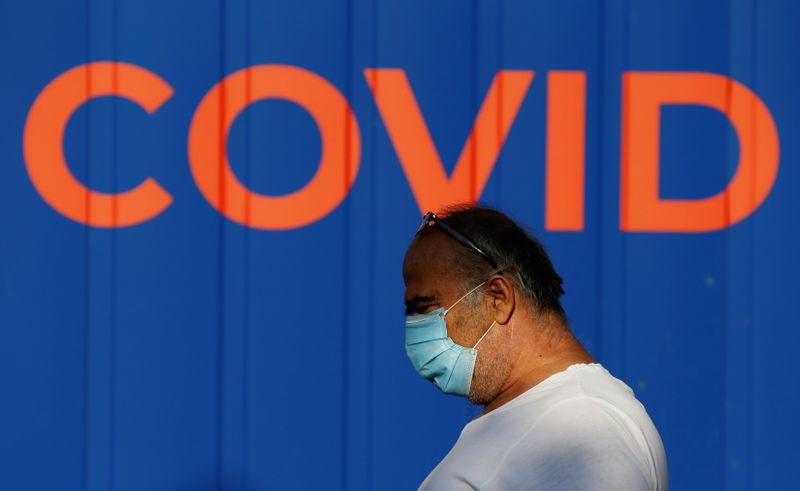 A man waits to get tested for the coronavirus disease