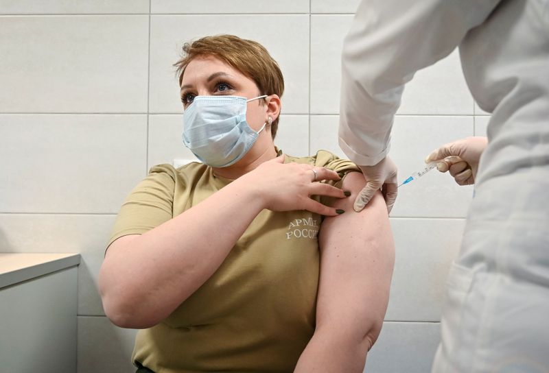 FILE PHOTO: A Russian Army service member receives an injection