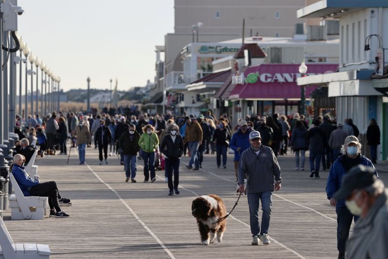 People try to keep a social distance on the boardwalk
