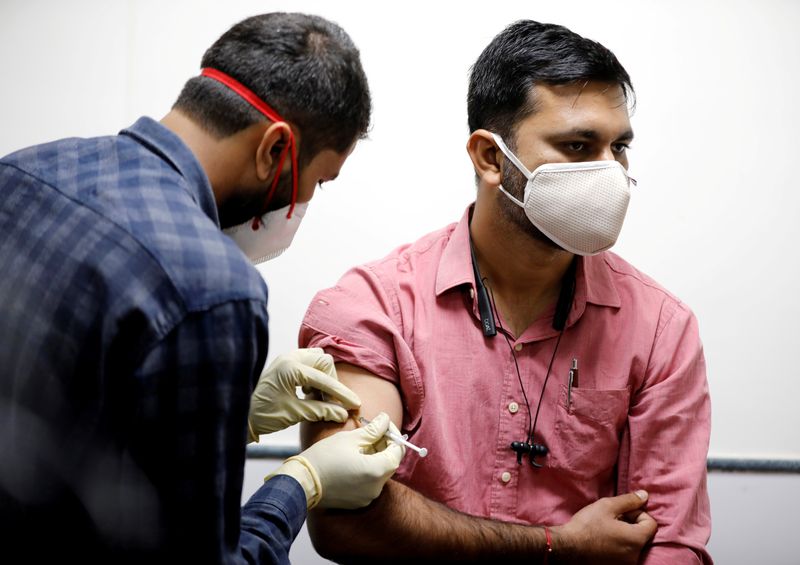 FILE PHOTO: A medic administers COVAXIN, an Indian government-backed experimental