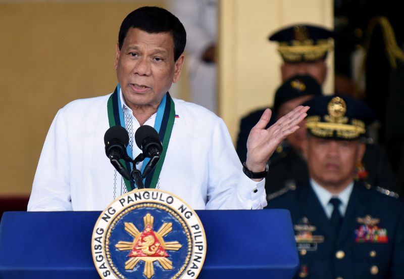 FILE PHOTO: Philippine President Rodrigo Duterte gestures during AFP change