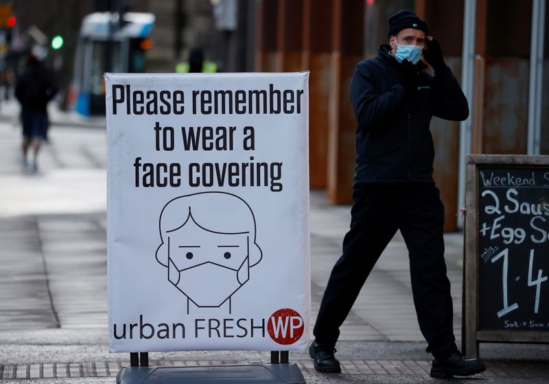Sign encouraging people to wear face coverings amid the COVID-19