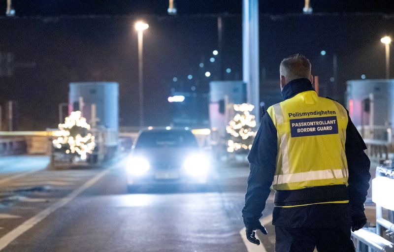 A border control officer stands at Oresund bridge connecting Sweden
