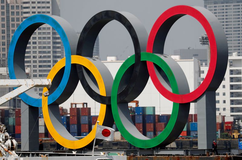 FILE PHOTO: The giant Olympic rings are seen behind Japan’s