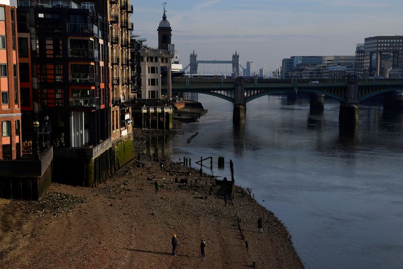 People exercise beside the River Thames amidst the COVID-19 pandemic,
