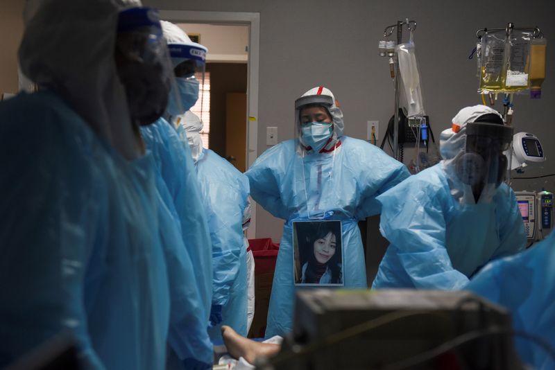 FILE PHOTO: Healthcare personnel work inside a COVID-19 unit in