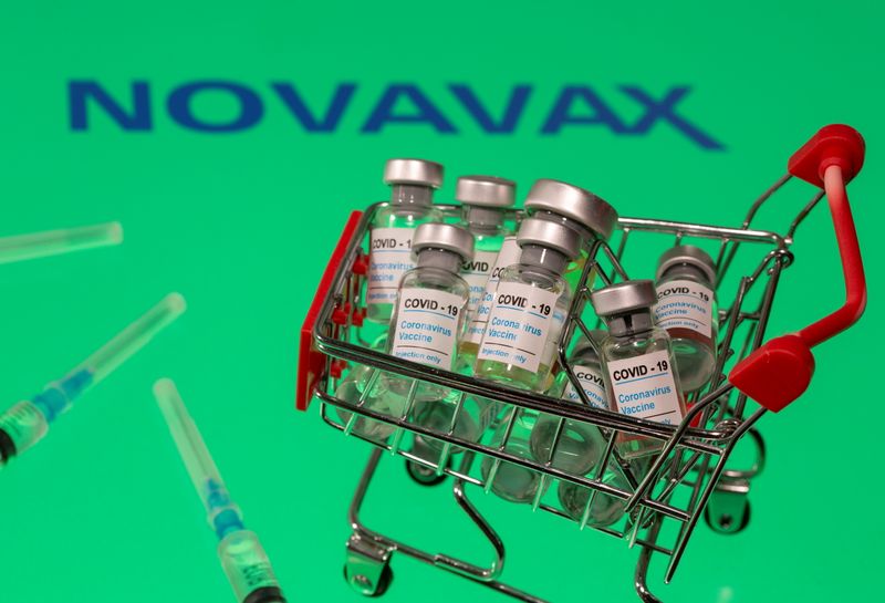 A small shopping basket filled with vials labeled “COVID-19 –