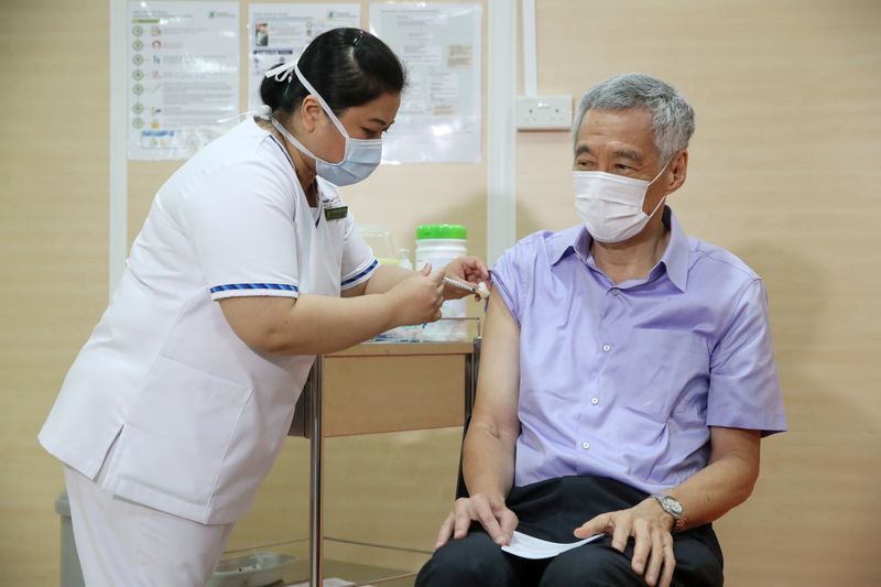 Singapore’s PM Lee Hsien Loong receives his COVID-19 vaccination jab