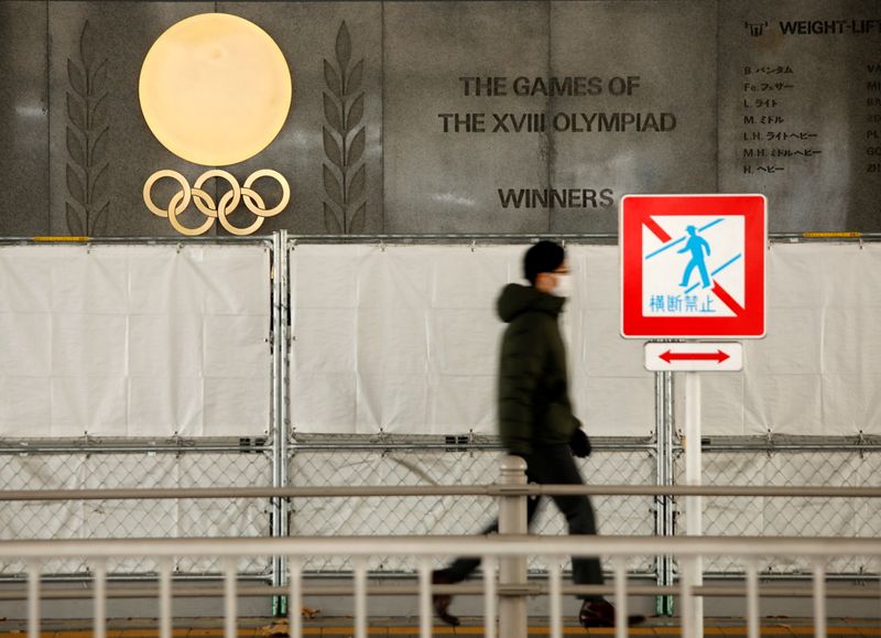 Olympic rings are seen outside the National Stadium in Tokyo