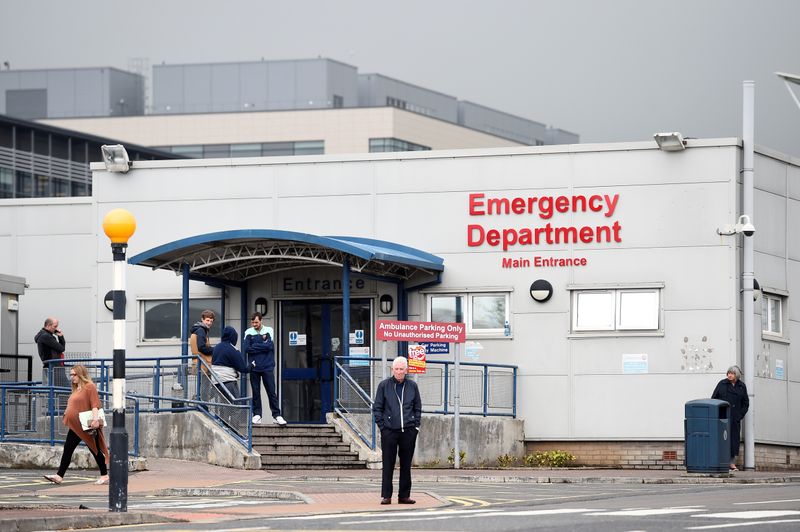 People wait outside the Emergency Department of Ulster Hospital in