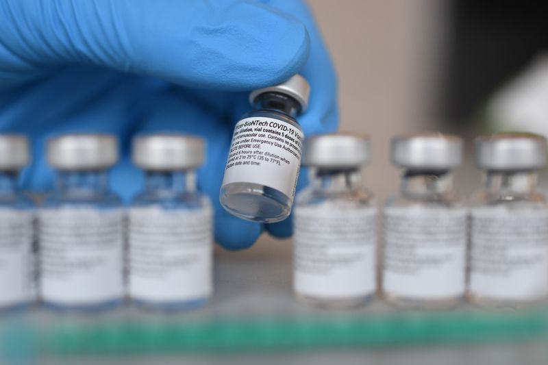 Vials containing doses of the Pfizer-BioNTech COVID-19 vaccine are seen