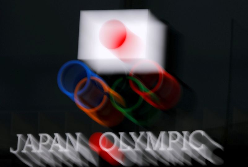 FILE PHOTO: Olympic rings and Japanese national flag are seen