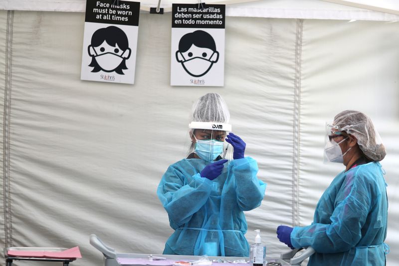 FILE PHOTO: Healthcare workers prepare Pfizer coronavirus disease (COVID-19) vaccinations