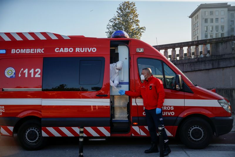 An ambulance carrying a COVID-19 patient is seen outside Santa