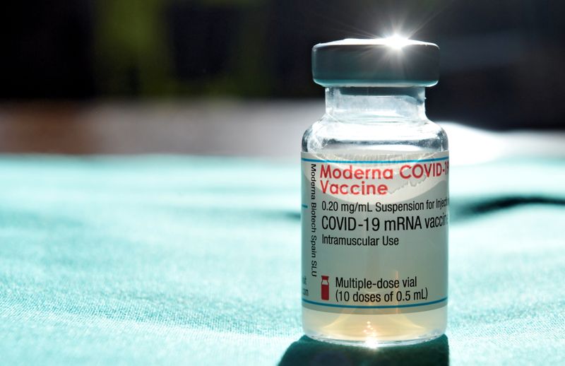 People receive a dose of the Moderna coronavirus disease (COVID-19)