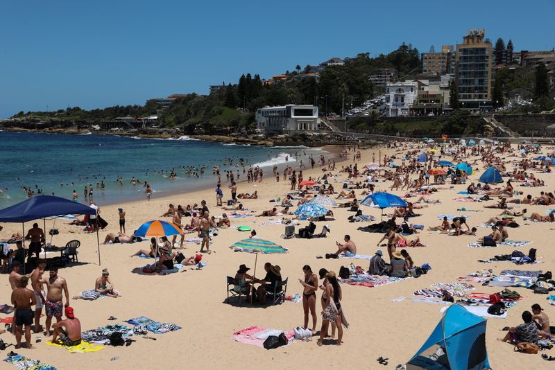 Beachgoers enjoy a summer day at Coogee Beach in Sydney