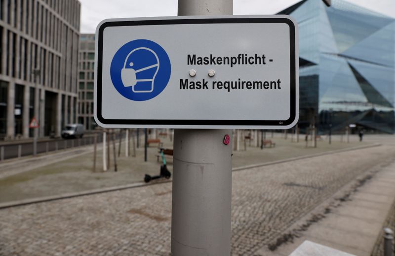 A sign informs of the face mask requirement during lockdown