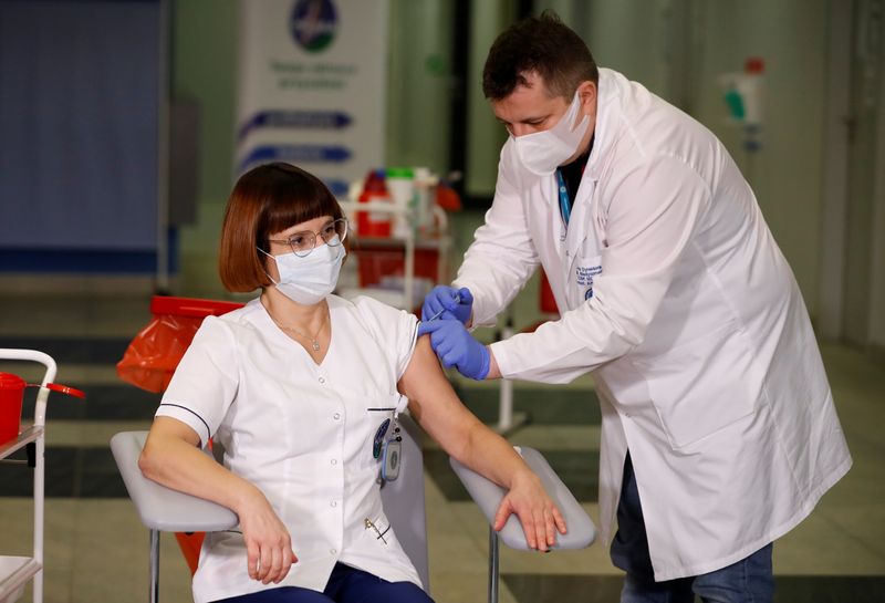 FILE PHOTO: Nurse Alicja Jakubowska is vaccinated with the Pfizer/BioNTech