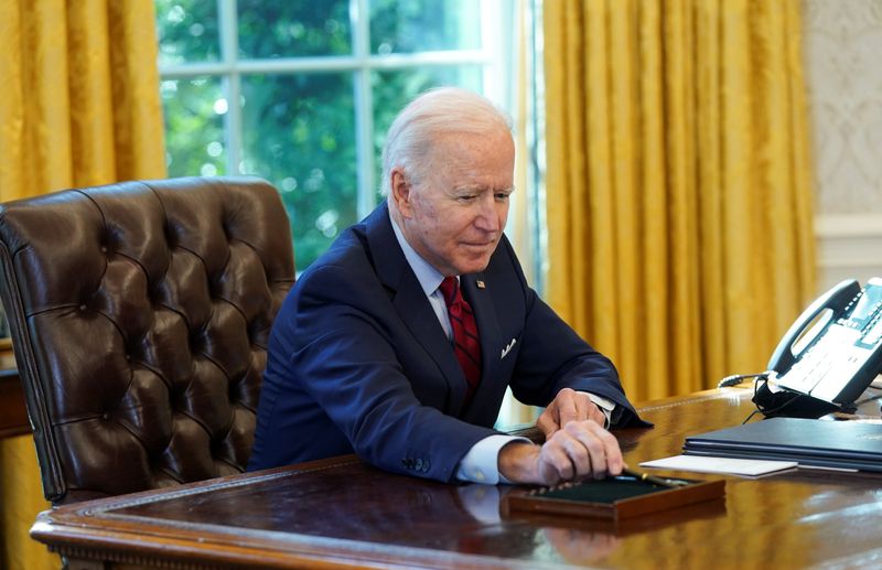 U.S. President Biden signs executive orders on access to affordable