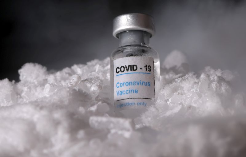 FILE PHOTO: Vials labelled “COVID-19 Coronavirus Vaccine” are placed on