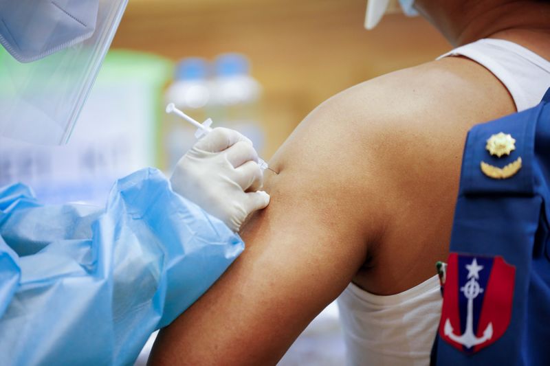 FILE PHOTO: Receiving COVID-19 vaccine ahead of the opening of
