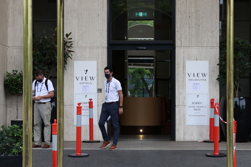 People depart a hotel where Australian Open tennis players were