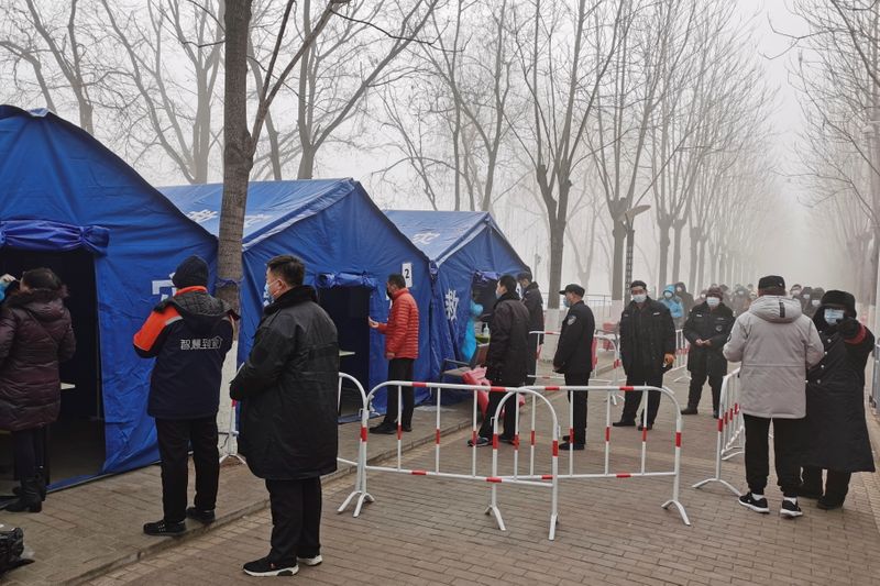 People line up for nucleic acid testing in Beijing