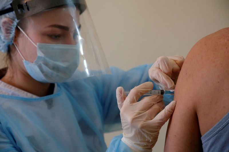 A person receives an injection with Sputnik V (Gam-COVID-Vac) vaccine