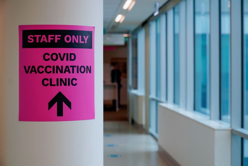 A sign for a COVID-19 vaccination clinic is seen in