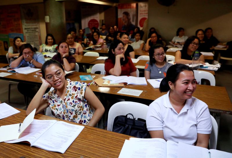 FILE PHOTO: Filipino workers, including nurses applying to work in