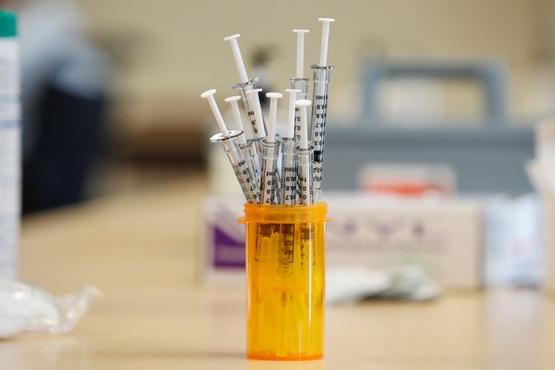 Senior citizens receive vaccinations against coronavirus disease in Evanston