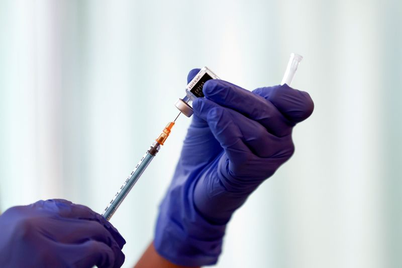 FILE PHOTO: FILE PHOTO: A medical worker fills a syringe