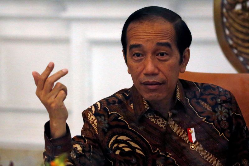 FILE PHOTO: Indonesian President Joko Widodo gestures during an interview