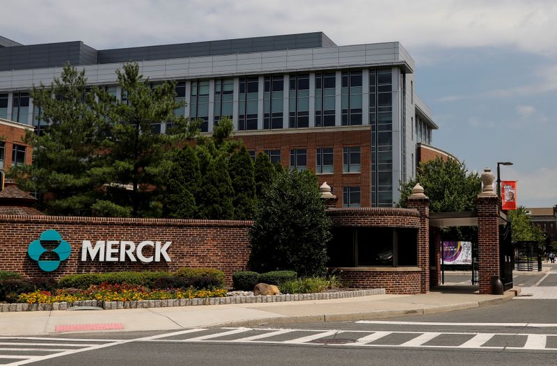 The Merck logo is seen at a gate to the