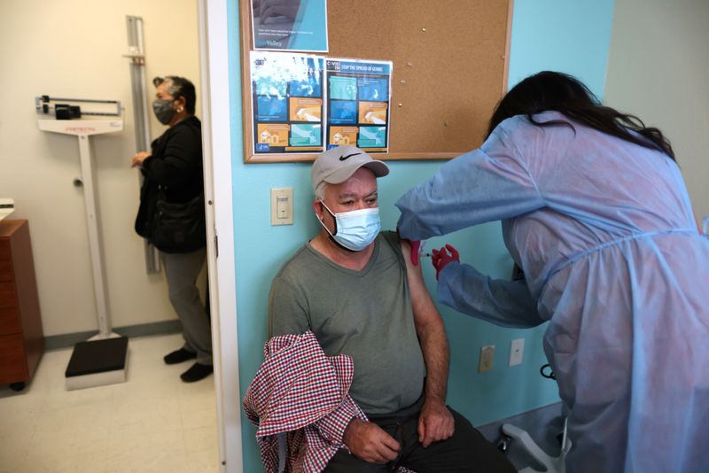 FILE PHOTO: Antonio Avila, 73, receives a coronavirus disease (COVID-19)