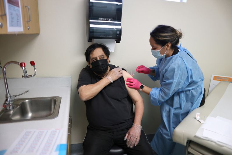 FILE PHOTO: Rigoberto Bojorquez, 76, receives a coronavirus disease (COVID-19)