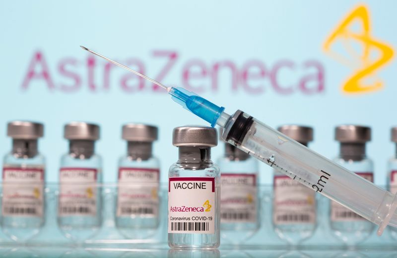 Vials labelled “AstraZeneca COVID-19 Coronavirus Vaccine” and a syringe are