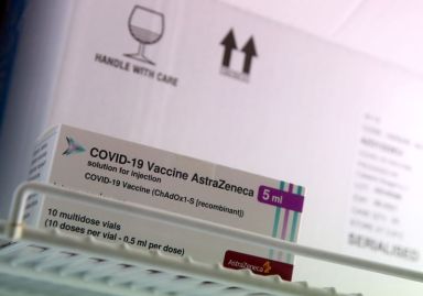 Boxes of AstraZeneca COVID-19 vaccine is seen in a fridge